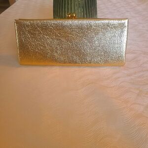 Vintage gold textured clutch with rich deep purple lining. Immaculate condition.